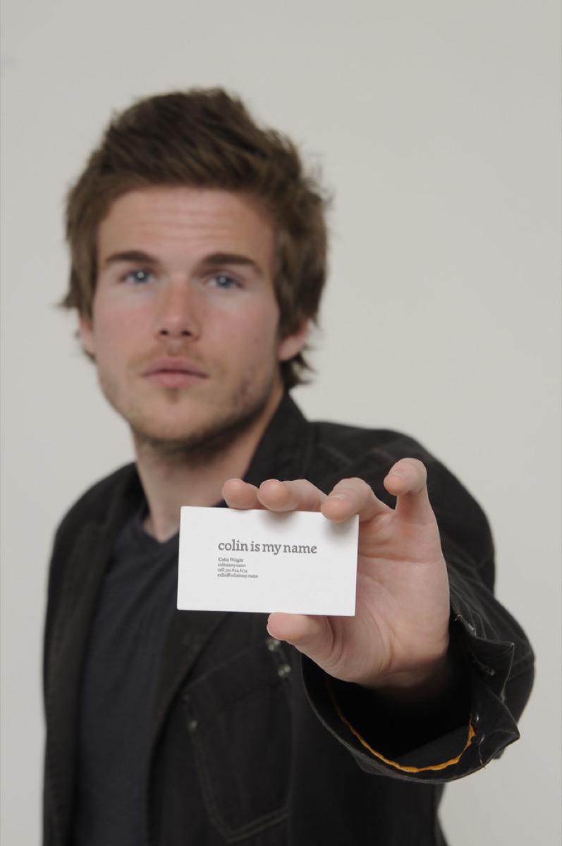 Colin Wright holding a Colin Is My Name business card